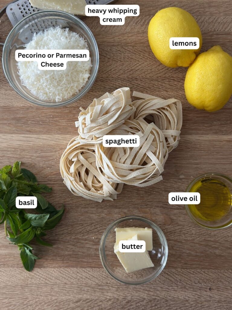 Ingredients for Spaghetti with Lemon Cream Sauce on a cutting board.