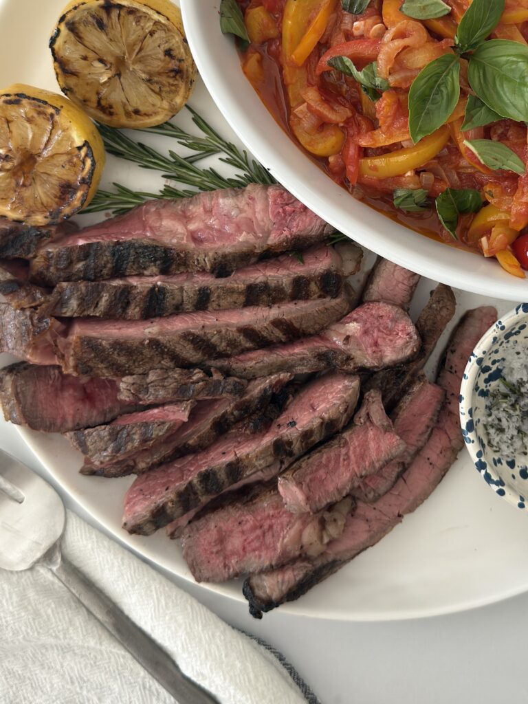 Grilled Italian steak sliced and served with pepperonata pasta, charred lemon, and rosemary sea salt.