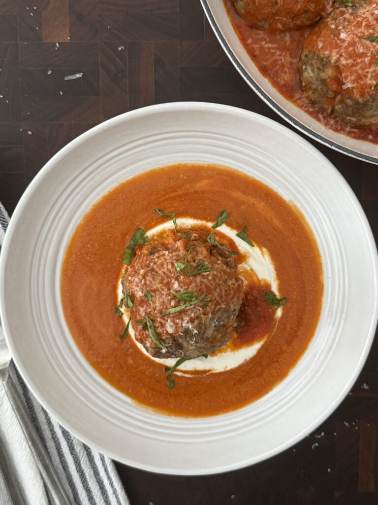 Juicy ricotta meatballs served with a creamy dollop of ricotta.