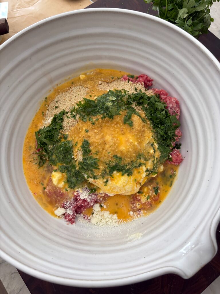 Eggs, breadcrumbs, and Pecorino Romano—binding ingredients for meatballs.