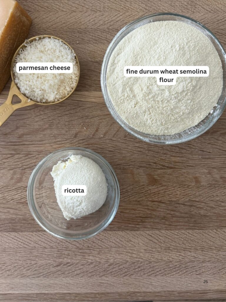 Ingredients to make the semolina pasta dough on a wooden cutting board.