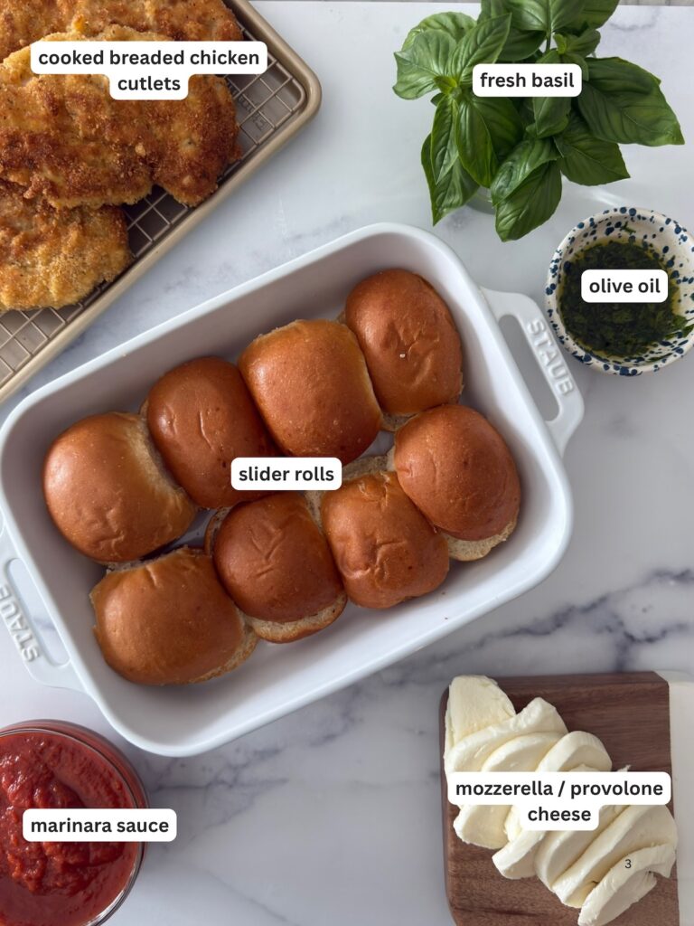 Ingredients for the chicken parm sliders are displayed on a white surface.