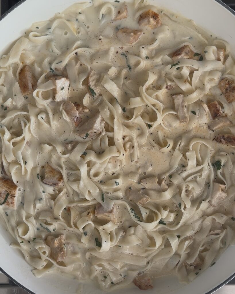 Creamy blackened chicken Alfredo with sliced chicken tossed into silky Parmesan fettuccine sauce for an easy homemade pasta dinner.