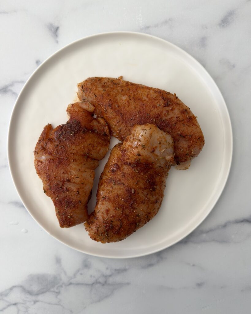 Blackened chicken breasts seasoned with smoky spices, seared until golden and juicy for creamy blackened chicken fettuccine Alfredo.