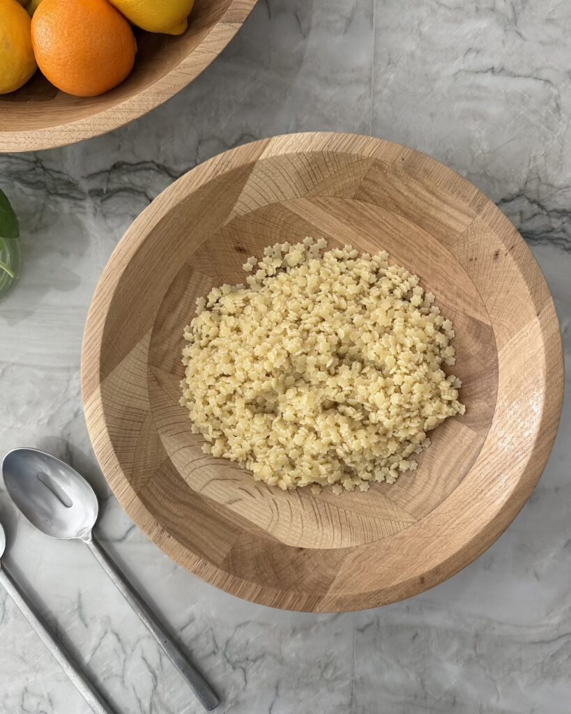 Cooked pastina in a wooden bowl for pastina salad